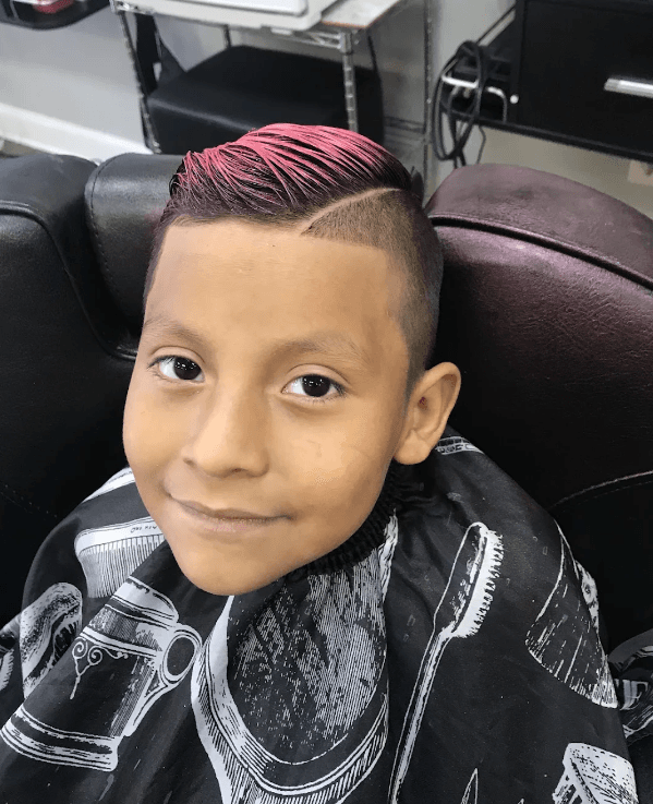 Proud young client showing his fresh haircut