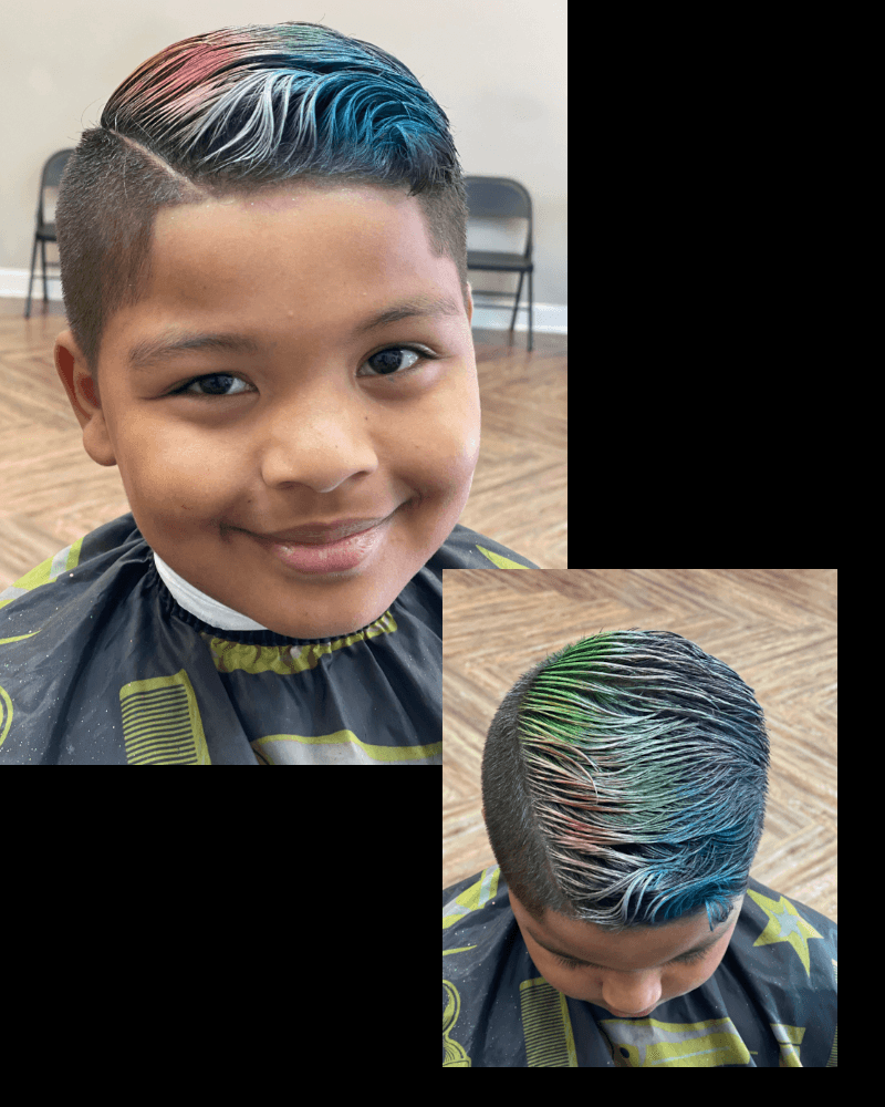 Proud young client showing the front and top of his colorful haircut